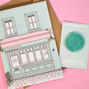 Greetings Card & Gift Token showing Crumbs & Doilies Soho storefront illustration with a recycled token for 6 cupcakes or treats.